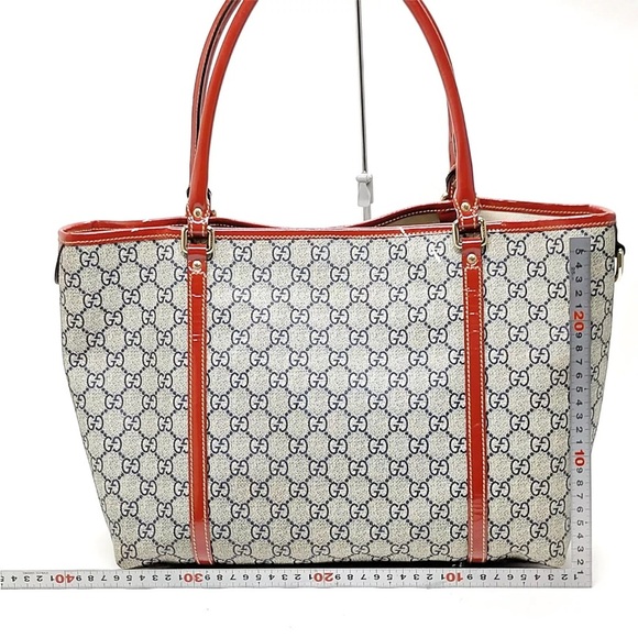 ๐๐๐ฏ GUCCI Supreme Tattoo Heart Navy Blue PVC Tote Hand Bag - Picture 7 of 10